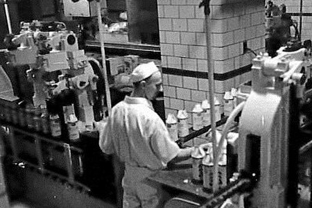 Consumer-Farmer Milk Cooperative workers processing and packaging milk